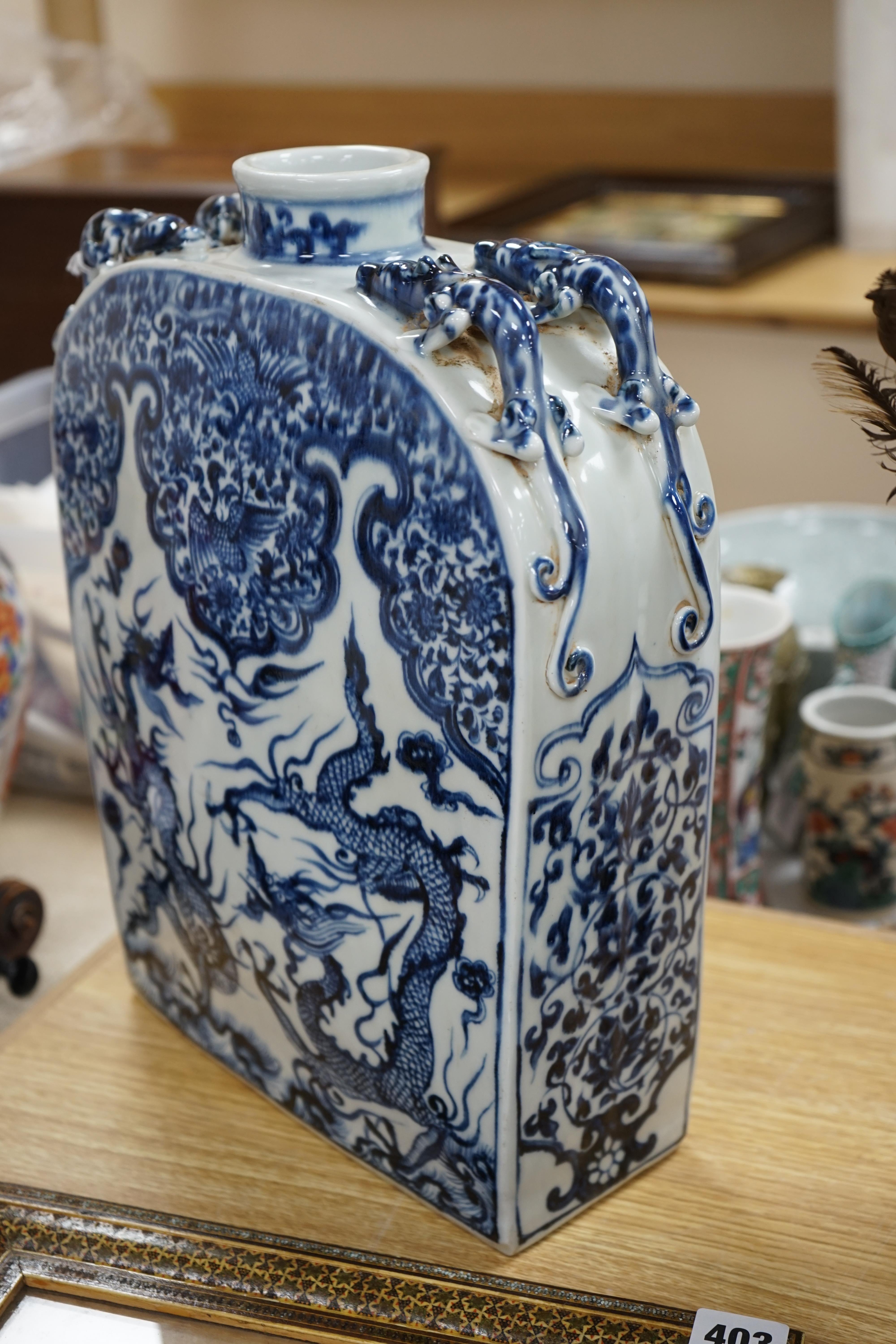 A large Chinese blue and white dragon flask, 39cm high. Condition - good